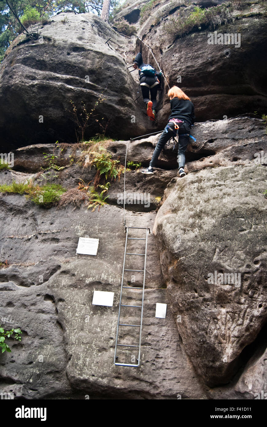 climbers on the Nonnensteig klettersteig in Nonnenfelsen in Zittauer  Gebirge mountains in Sachsen Stock Photo - Alamy