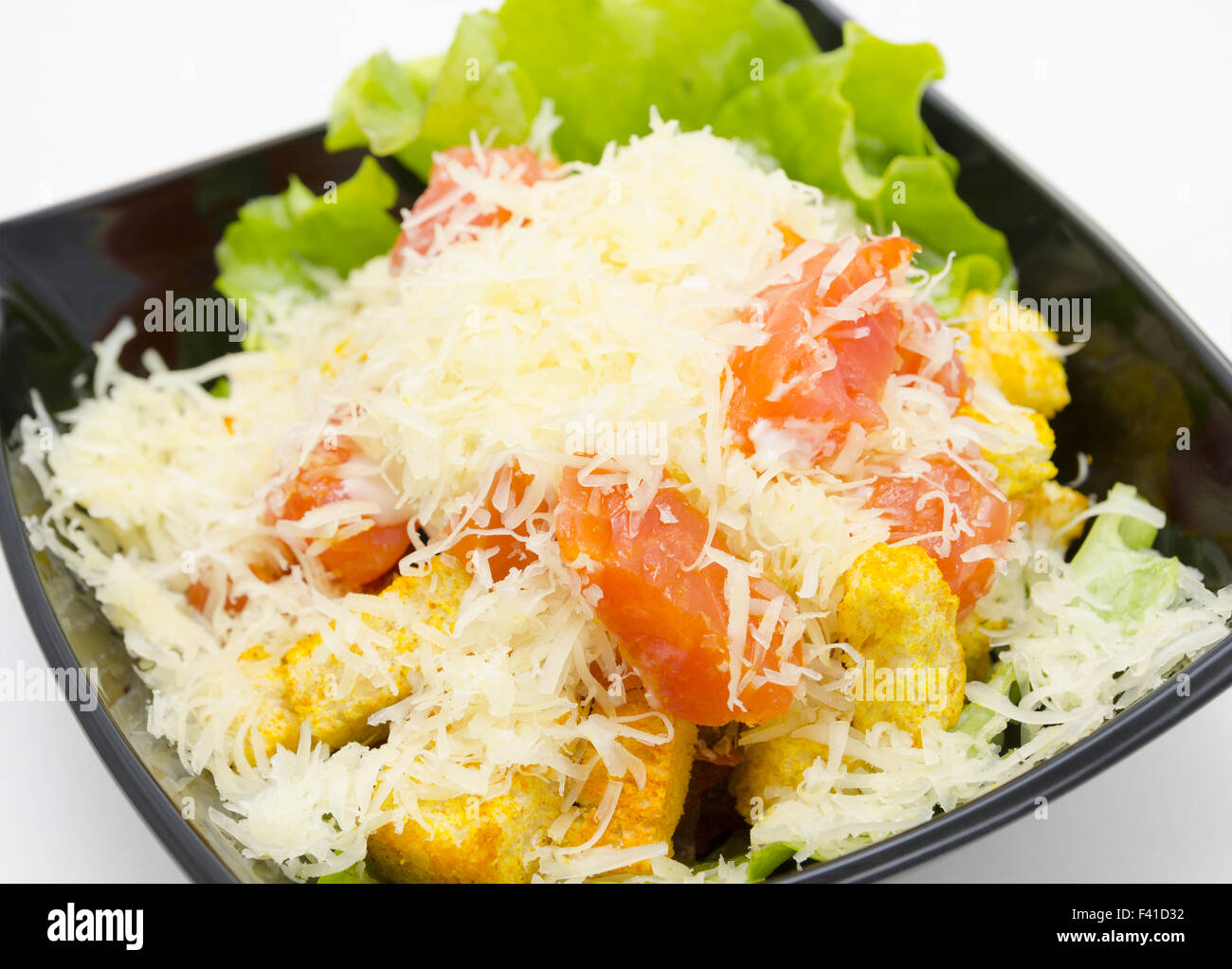 caesar salad covered with grated cheese Stock Photo