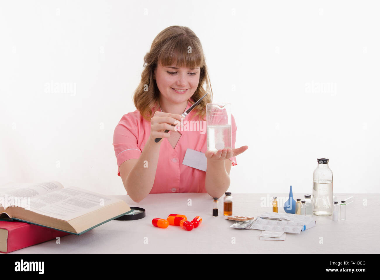 Student pharmacist conducts experiments Stock Photo