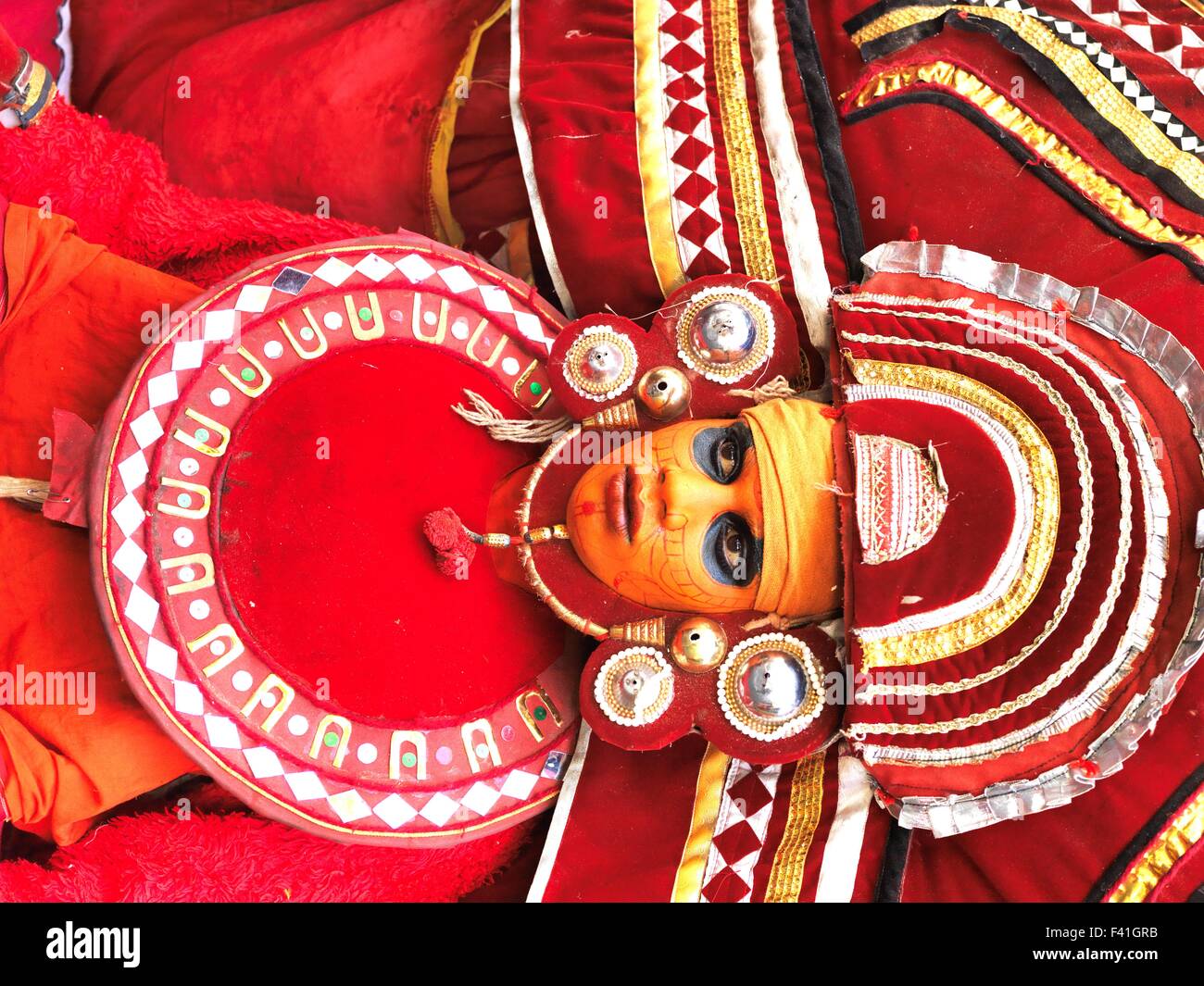 Theyyam (Teyyam, Theyyattam ) (Malayalam:തെയ്യം) is a popular ritual form of worship of North Malabar in Kerala, India. Stock Photo