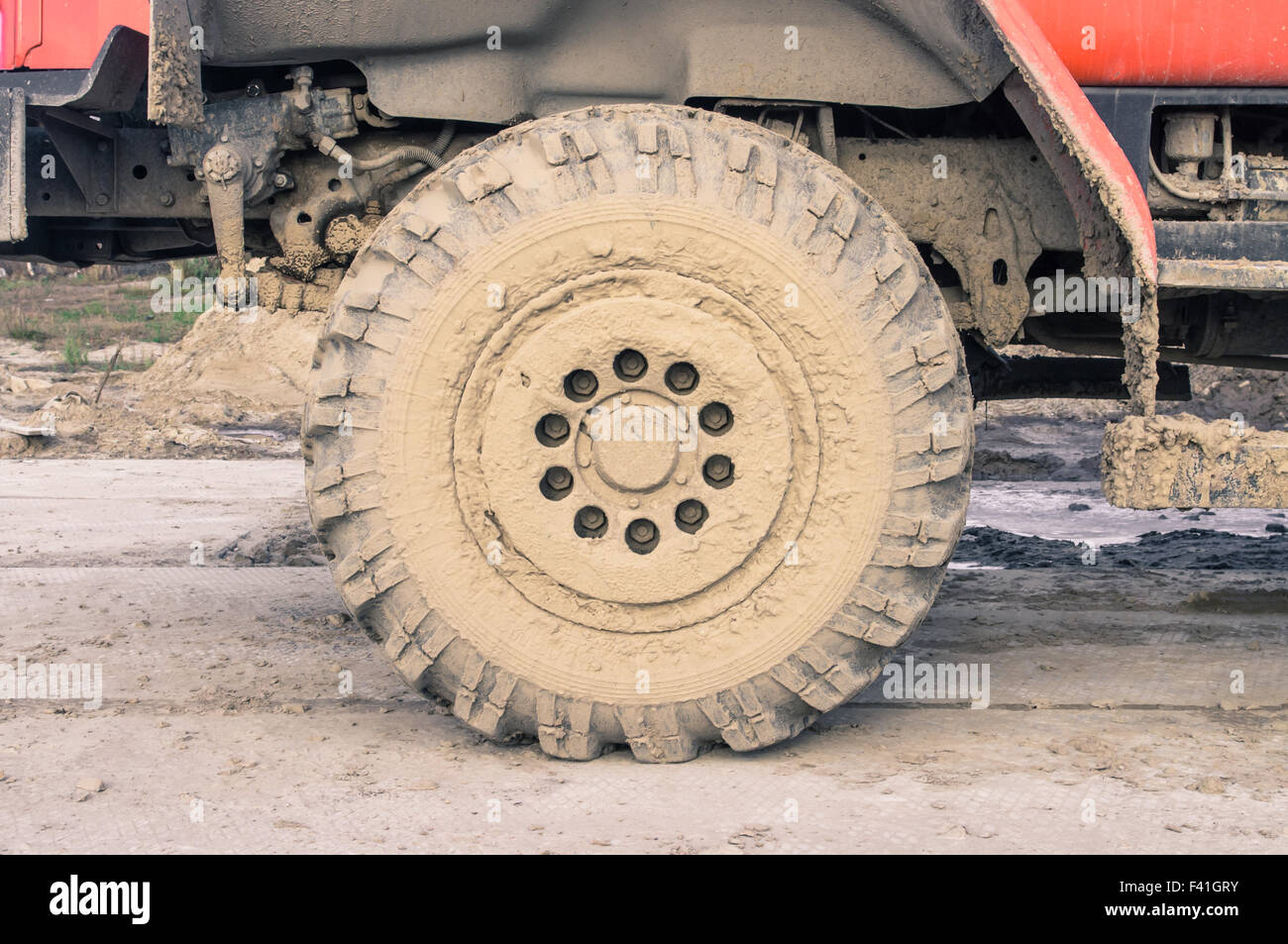 Dump truck wheel in the dirt on a construction site Stock Photo