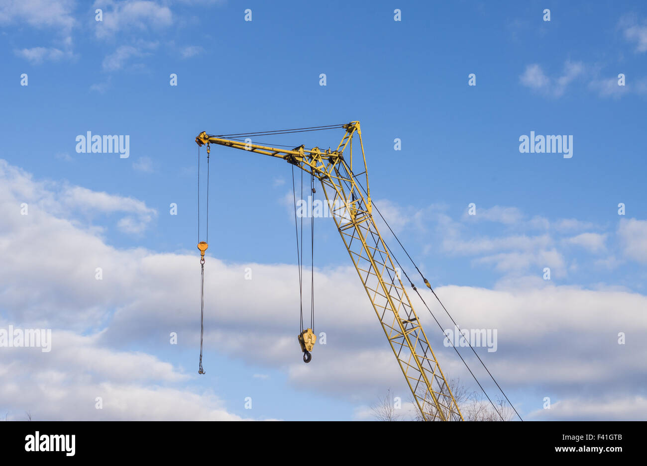 Mobile crane boom against the blue sky Stock Photo Alamy