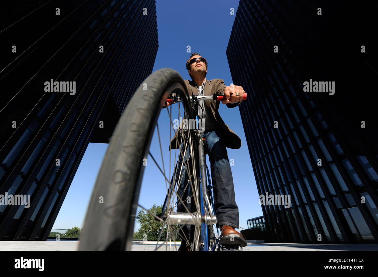 Man ride with his bike to work (MR Stock Photo Alamy