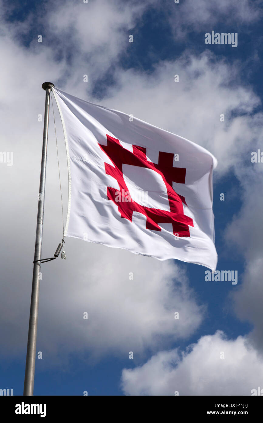 UK, England, Shropshire, Craven Arms, English Heritage flag flying in blue sky Stock Photo