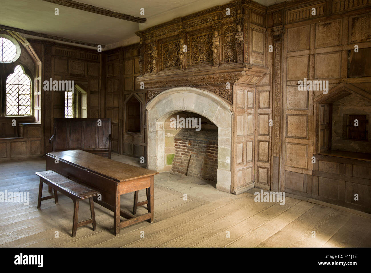 UK, England, Shropshire, Craven Arms, Stokesay Castle, The Solar, with ornately carved fire surround Stock Photo