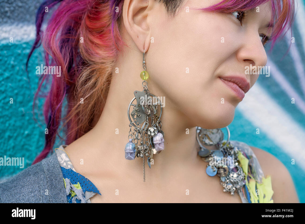 Close-up of young beautiful girl in harajuku style wearing steam punk style earrings Stock Photo