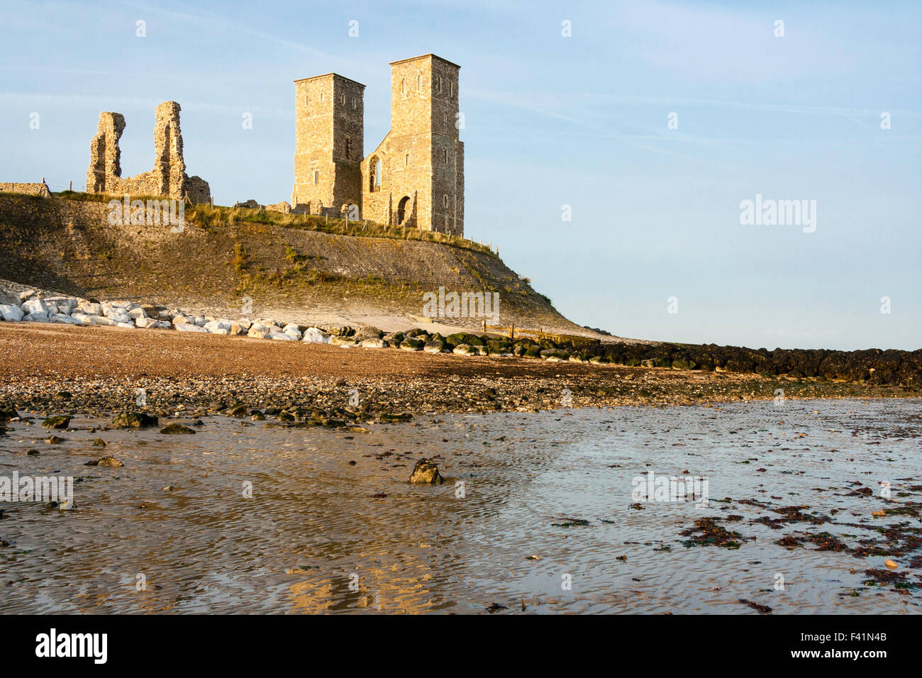 England, Reculver. The 12th century twin towers and ruins of the 7th century St Mary's church. Distant shot from beach and seashore. Stock Photo