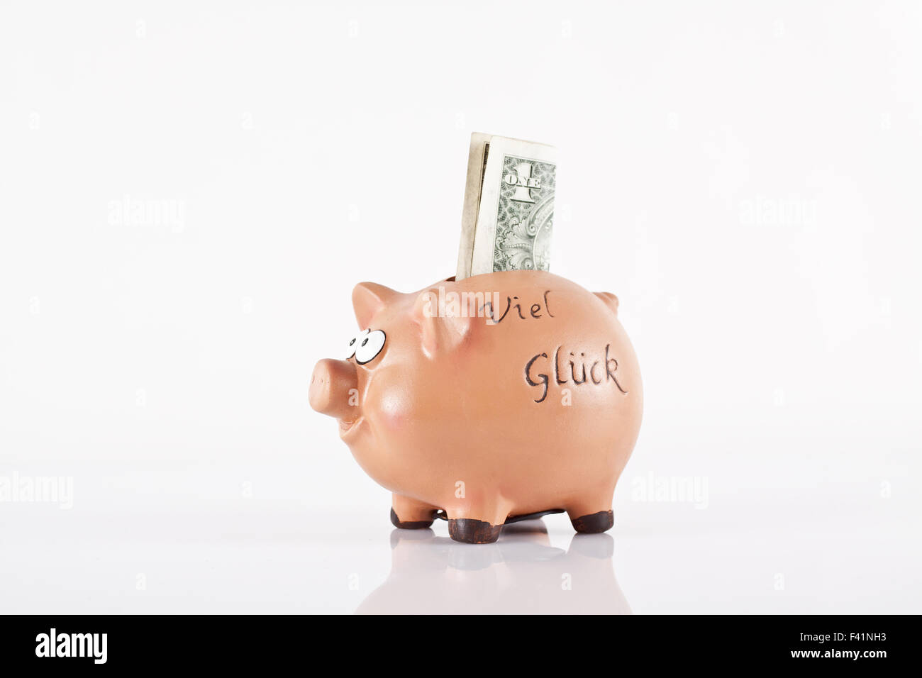 Piggy bank with  1 Dollar Stock Photo