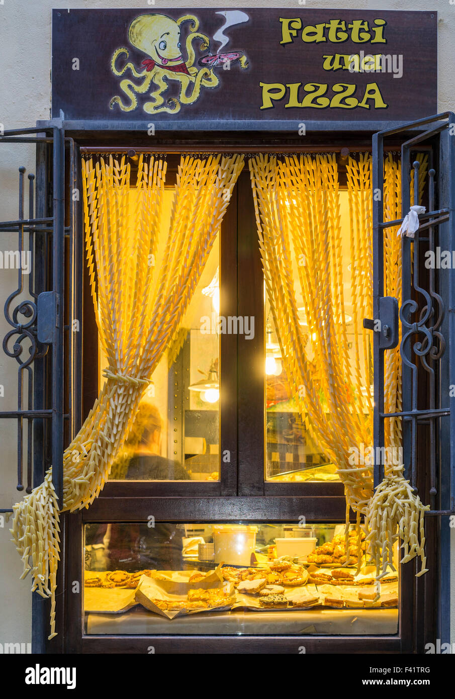 Window of a restaurant with a curtain made of pasta, Porto Venere