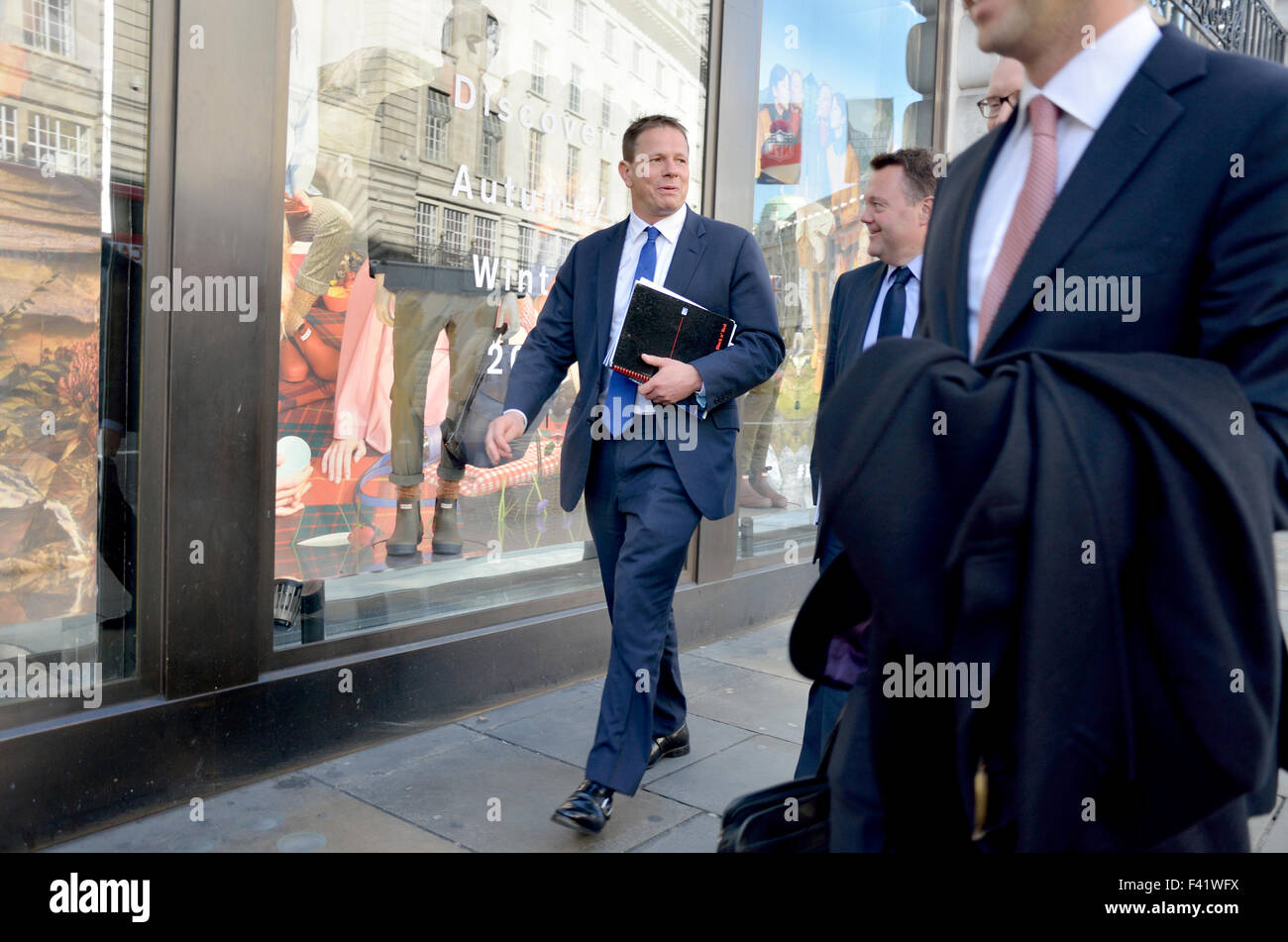 London, England, UK. Businessmen walking in the street Stock Photo