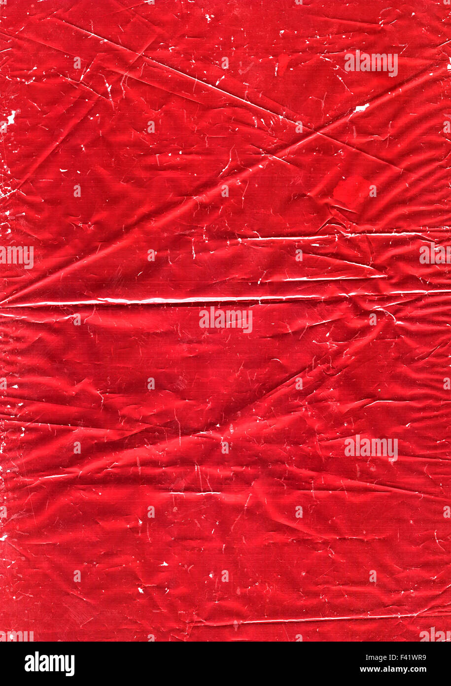 Old wrinkled red metallic wrapping paper background Stock Photo