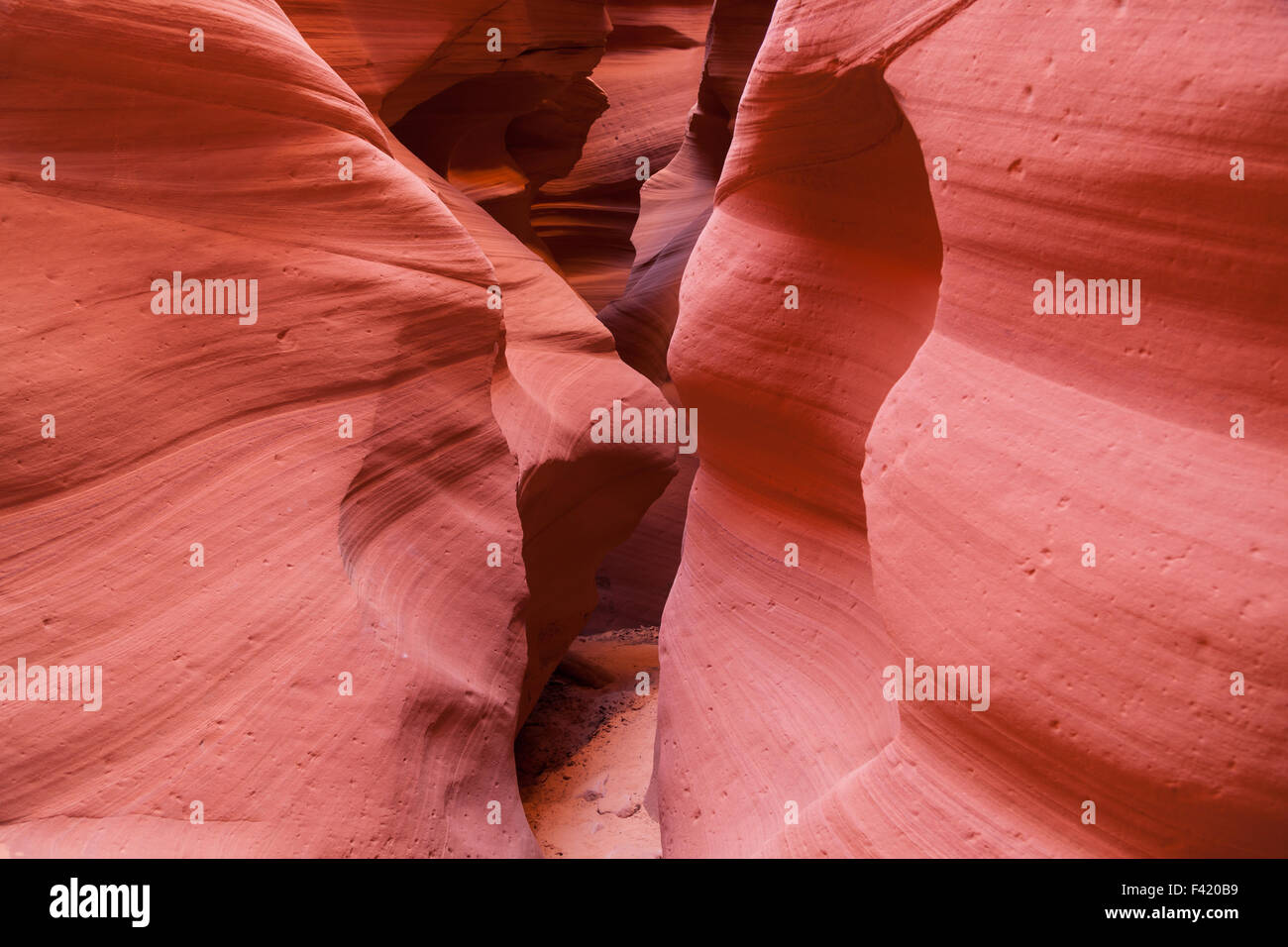 The beautifully smooth and colorful sandstone walls of Canyon X located in Page, AZ. Stock Photo
