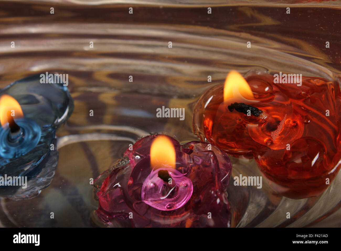 three wax candle on water Stock Photo Alamy