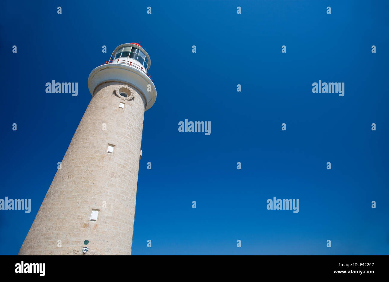 Lighthouse against clear blue sky Stock Photo