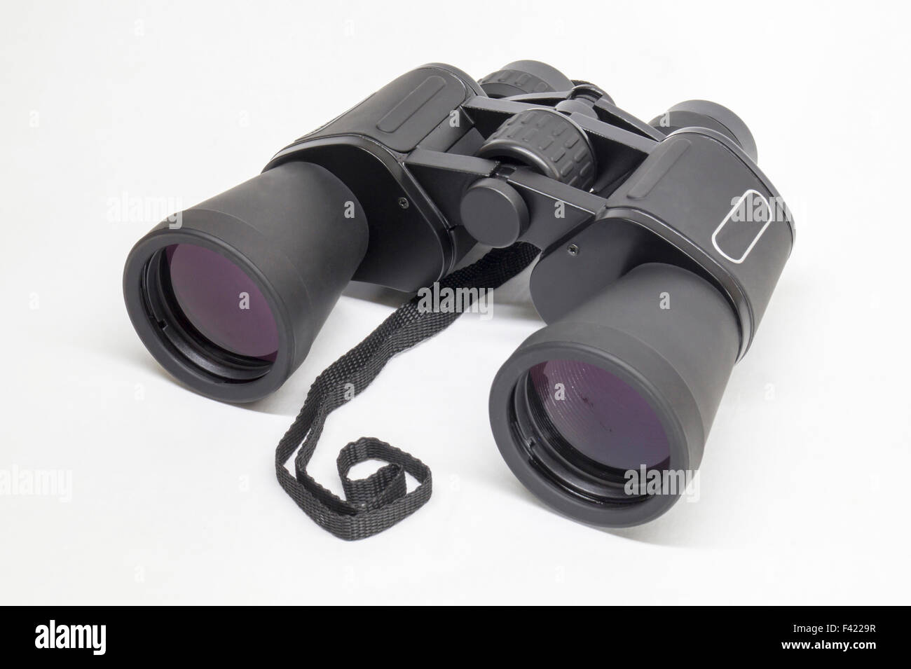 Black binoculars insulated on light background Stock Photo