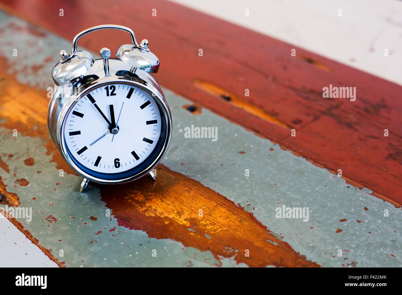 alarm clock on vintage old table Stock Photo - Alamy