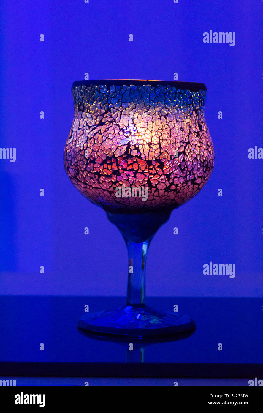 decorated glass illuminated by candle Stock Photo