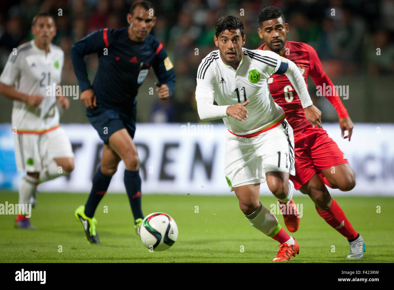 Toluca, Mexico. 13th Oct, 2015. Carlos Vela (Front) of Mexico vies with Gabriel Gomez (R) of Panama during an international friendly match held at Nemesio Diez Stadium, in Toluca City, capital of the State of Mexico, Mexico, on Oct. 13, 2015. Mexico won 1-0. Credit:  Pedro Mera/Xinhua/Alamy Live News Stock Photo