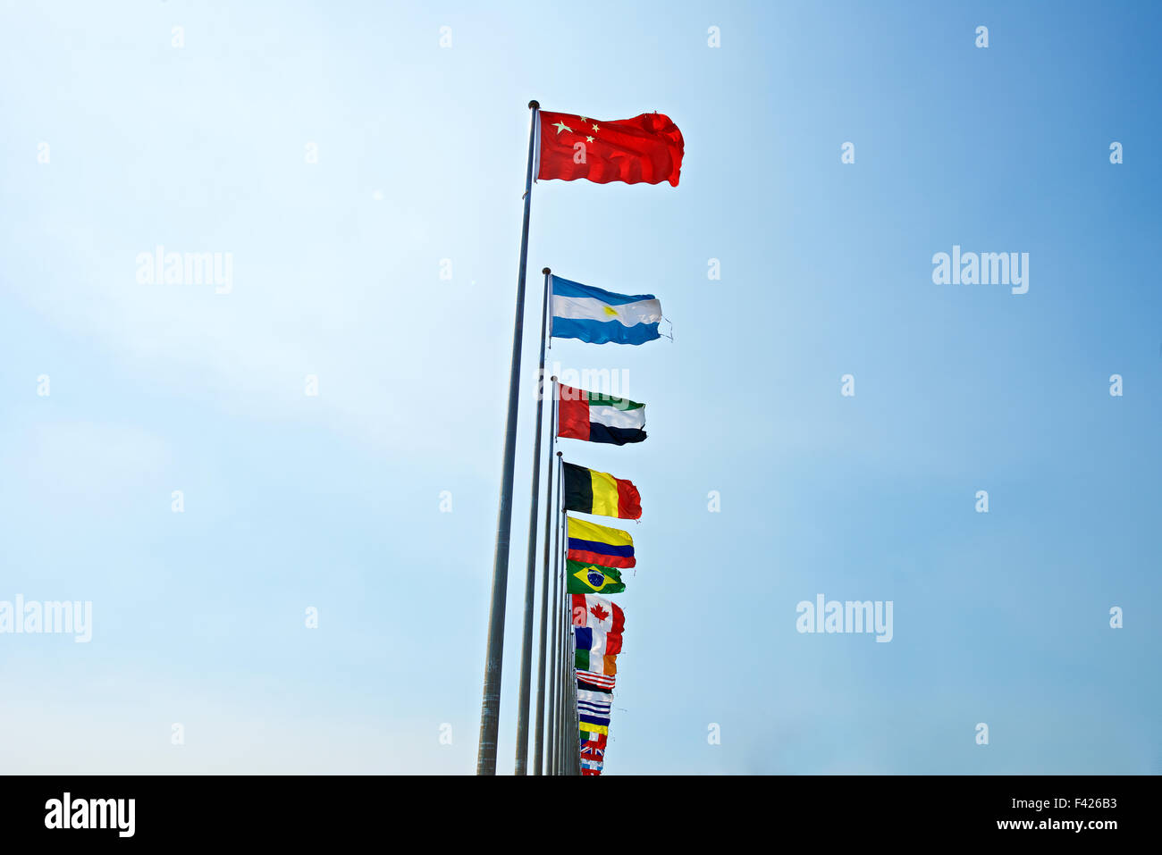 A row of flags with Chinese flag leading other nation. Rise of China