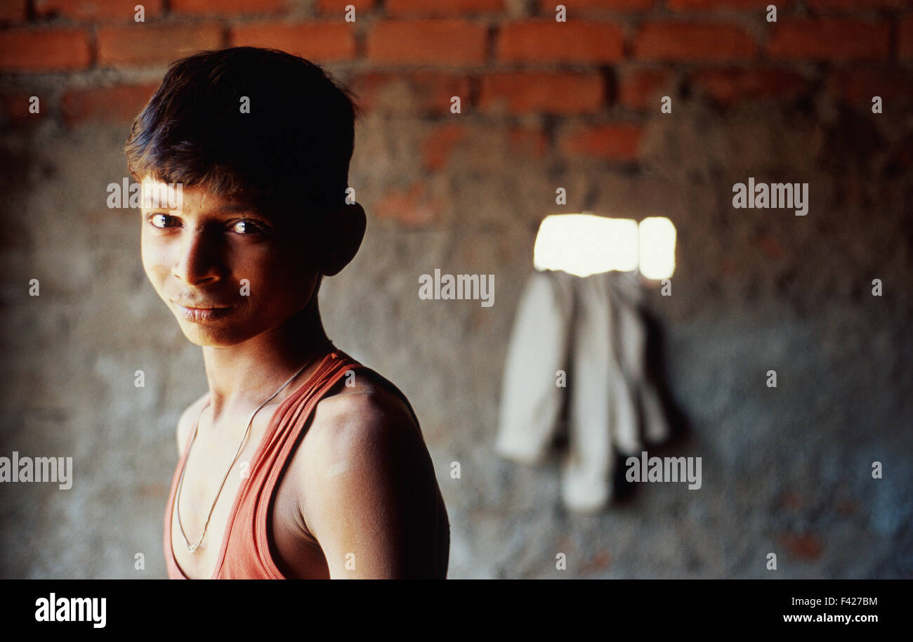 Boy working as a mason ( India) Stock Photo