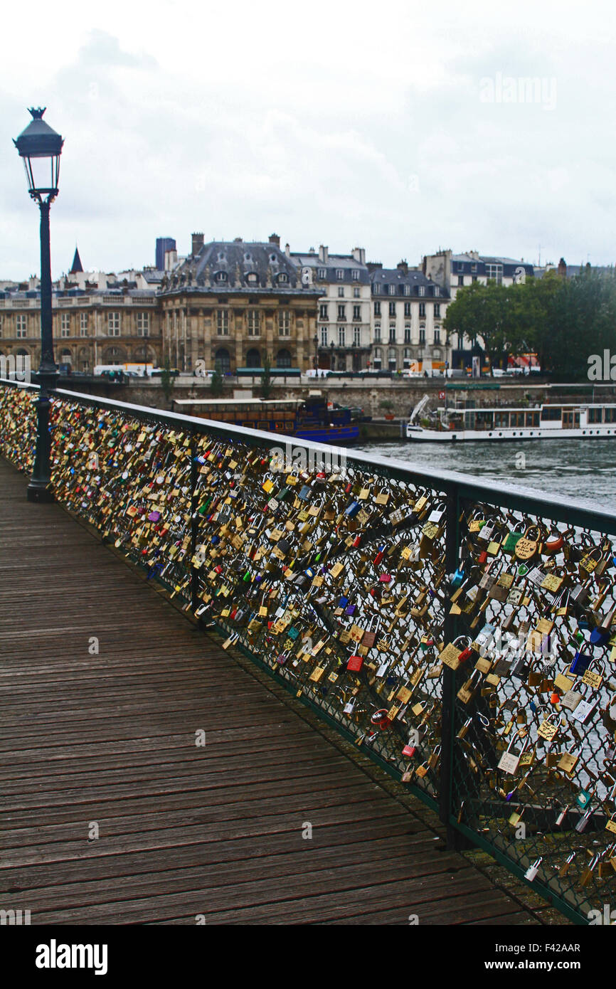 Love locks on Pont de Arts bridge in Paris with low view point Stock Photo  - Alamy