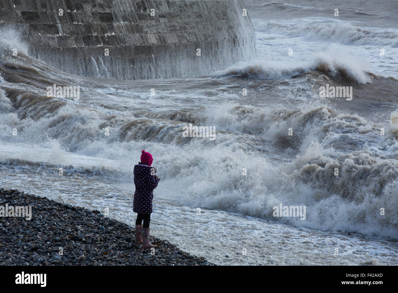 storm waves breaking over the Cobb at Lyme Regis, Jurassic Coast, Dorset, England, UK Stock Photo