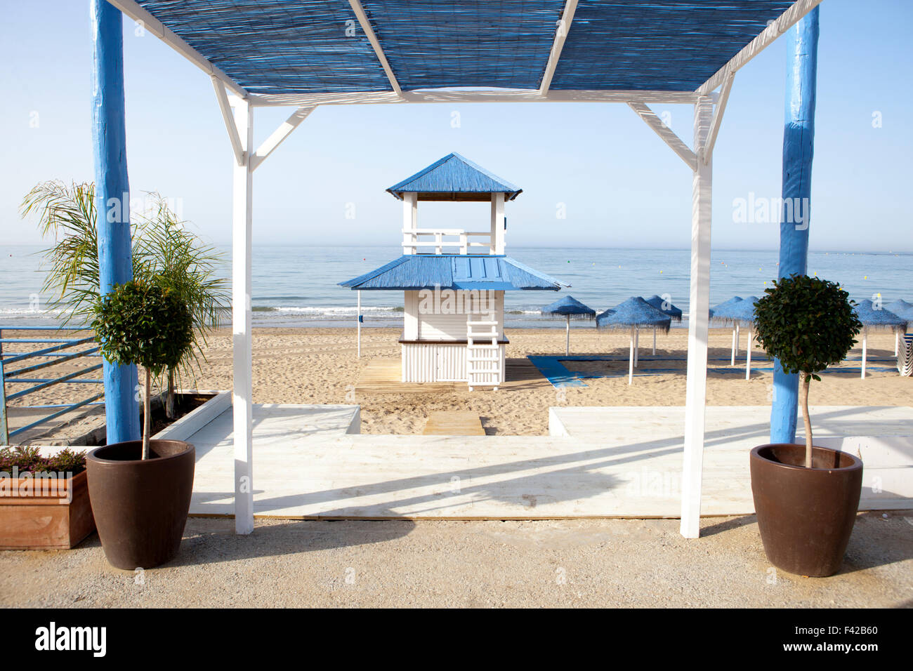 Wooden blue and white beach refreshments stand at beautiful white beach of south Spain Stock Photo