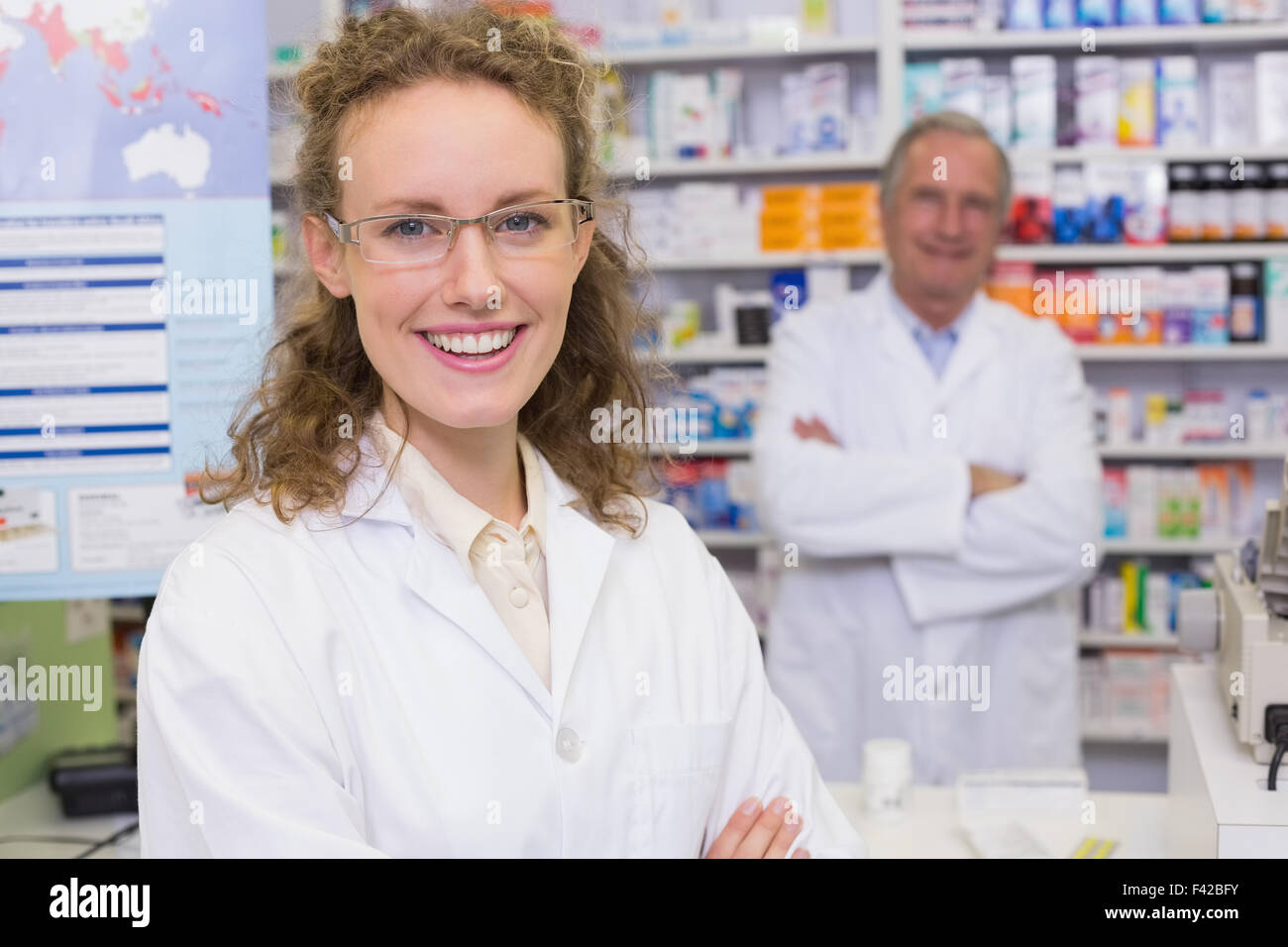 Team of pharmacists smiling at camera Stock Photo Alamy