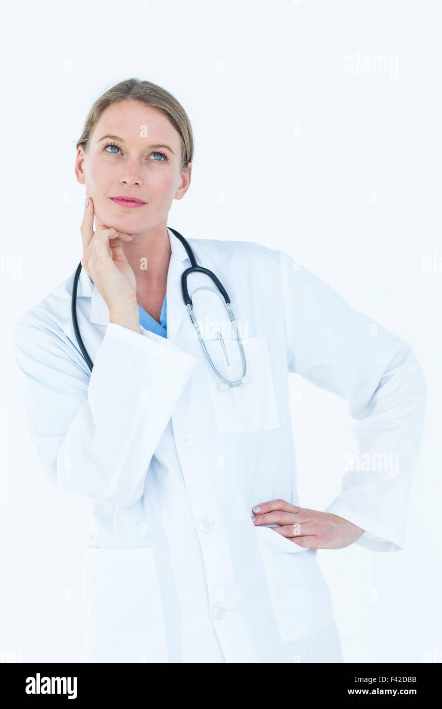Thoughtful doctor thinking about work Stock Photo - Alamy