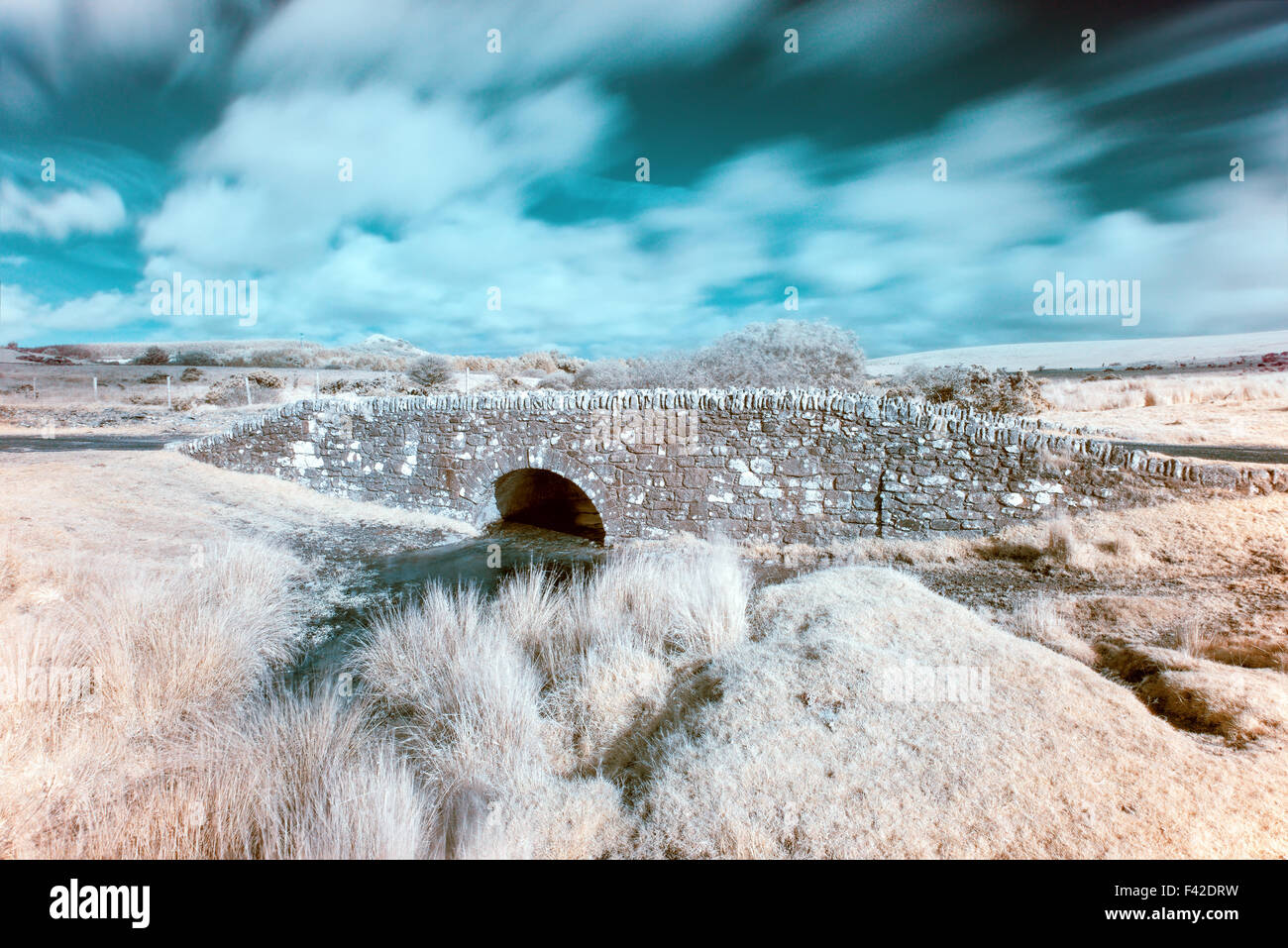 A colour infrared photo of an old bridge at Temple on Bodmin Moor in Cornwall Stock Photo