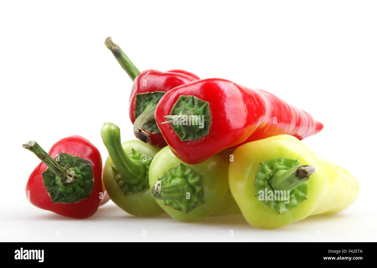 Red peppers on white background Stock Photo - Alamy