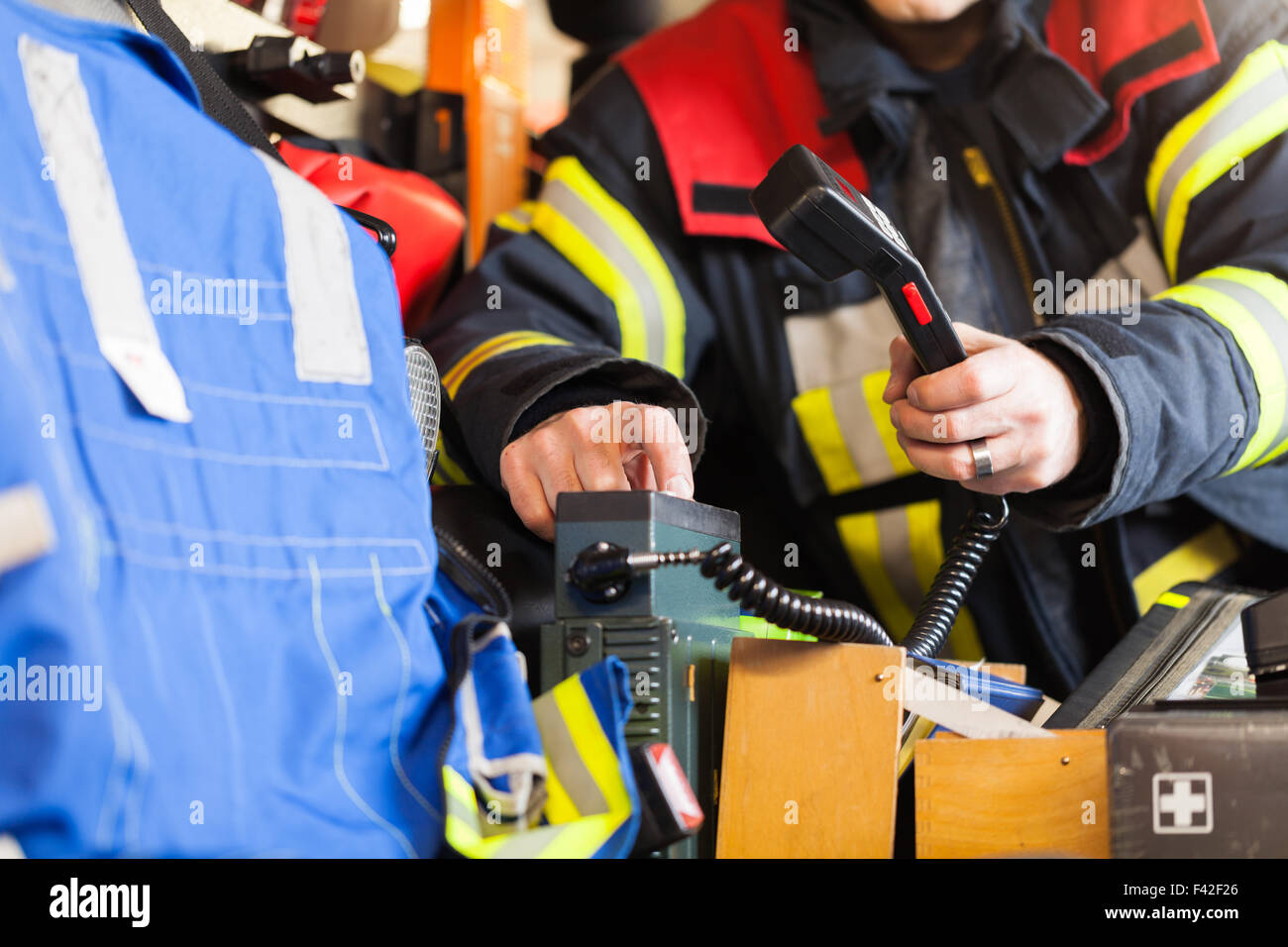 Firefighter serving a radio Stock Photo Alamy