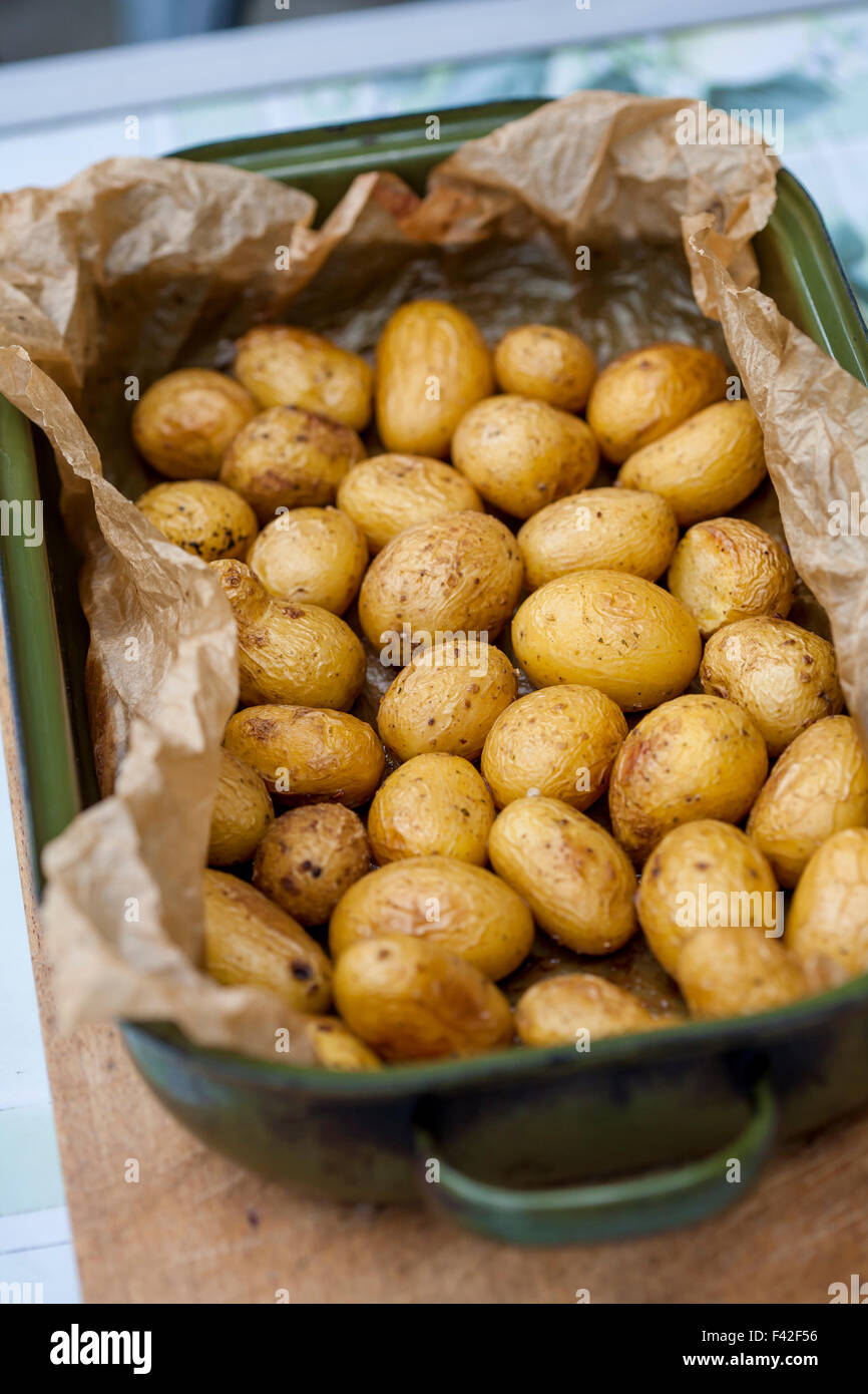 baked potatoes whole in their skins with thyme Stock Photo
