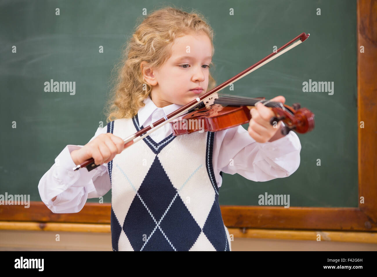 Cute pupil playing the violin Stock Photo - Alamy