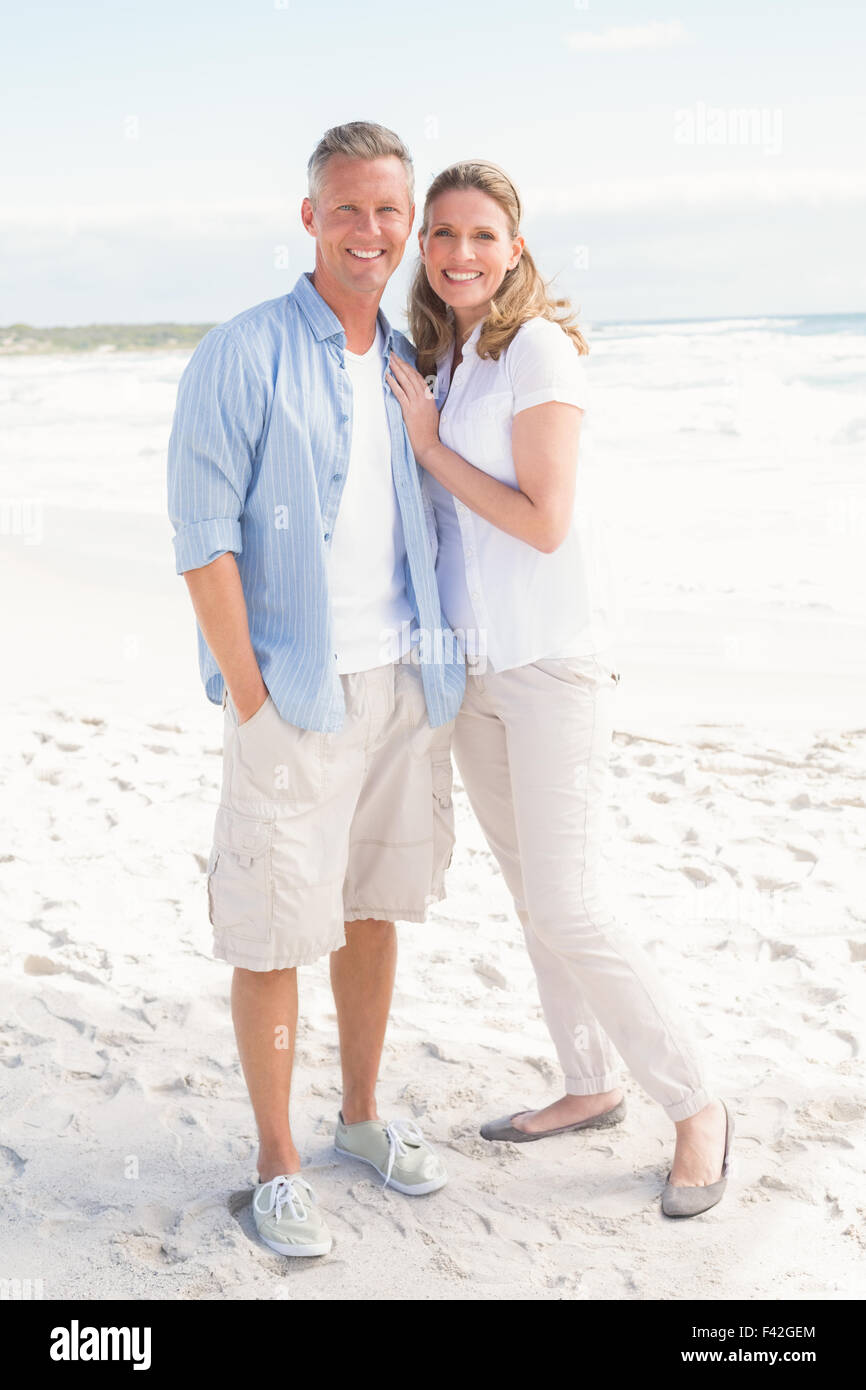 Happy couple smiling at camera Stock Photo - Alamy