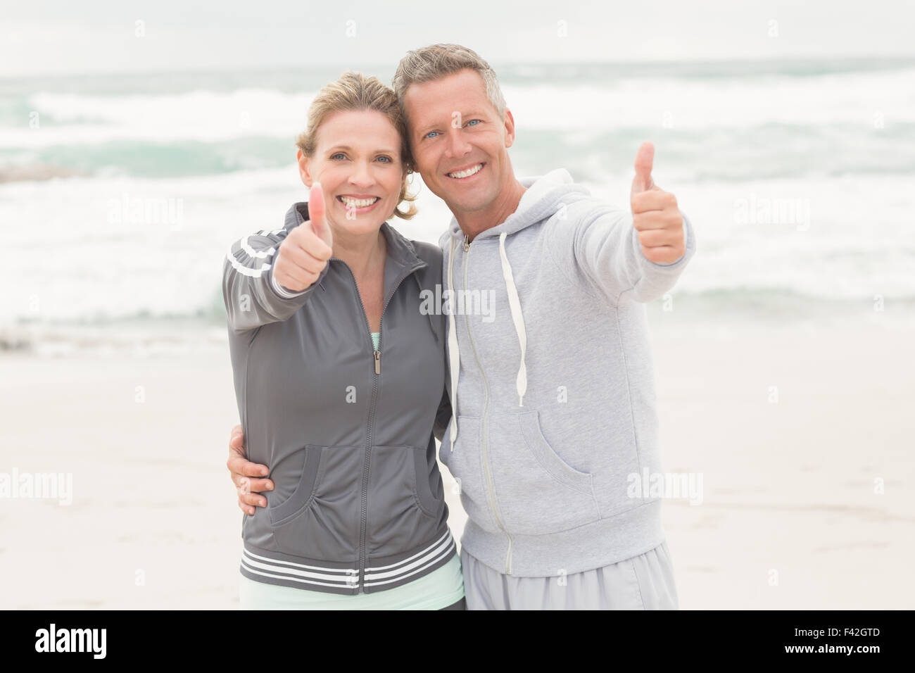 Fit couple thumbs up hi-res stock photography and images - Alamy