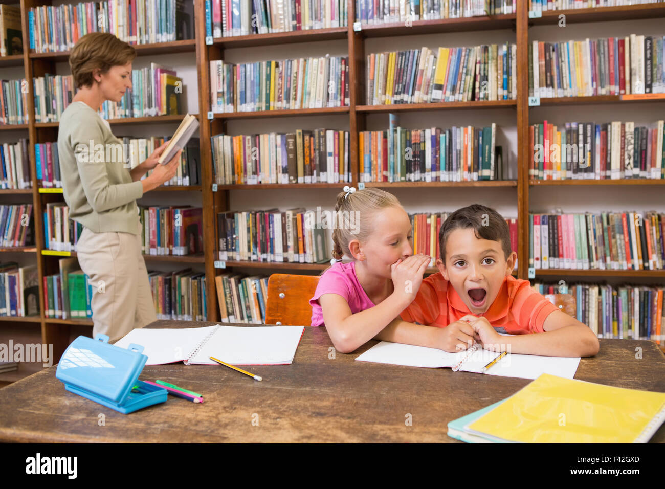 Girl talking teacher library hi-res stock photography and images - Alamy