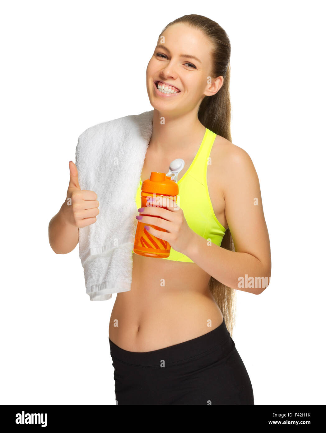 Sporty girl with towel and bottle isolated Stock Photo - Alamy