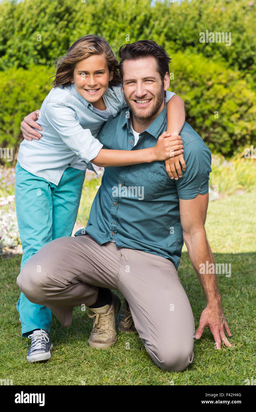 Father and son smiling at camera Stock Photo - Alamy