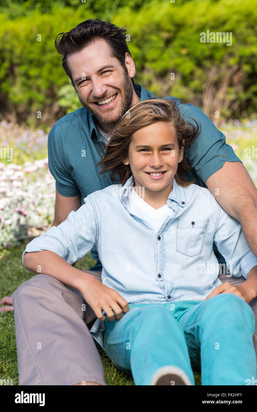 Father and son smiling at camera Stock Photo - Alamy