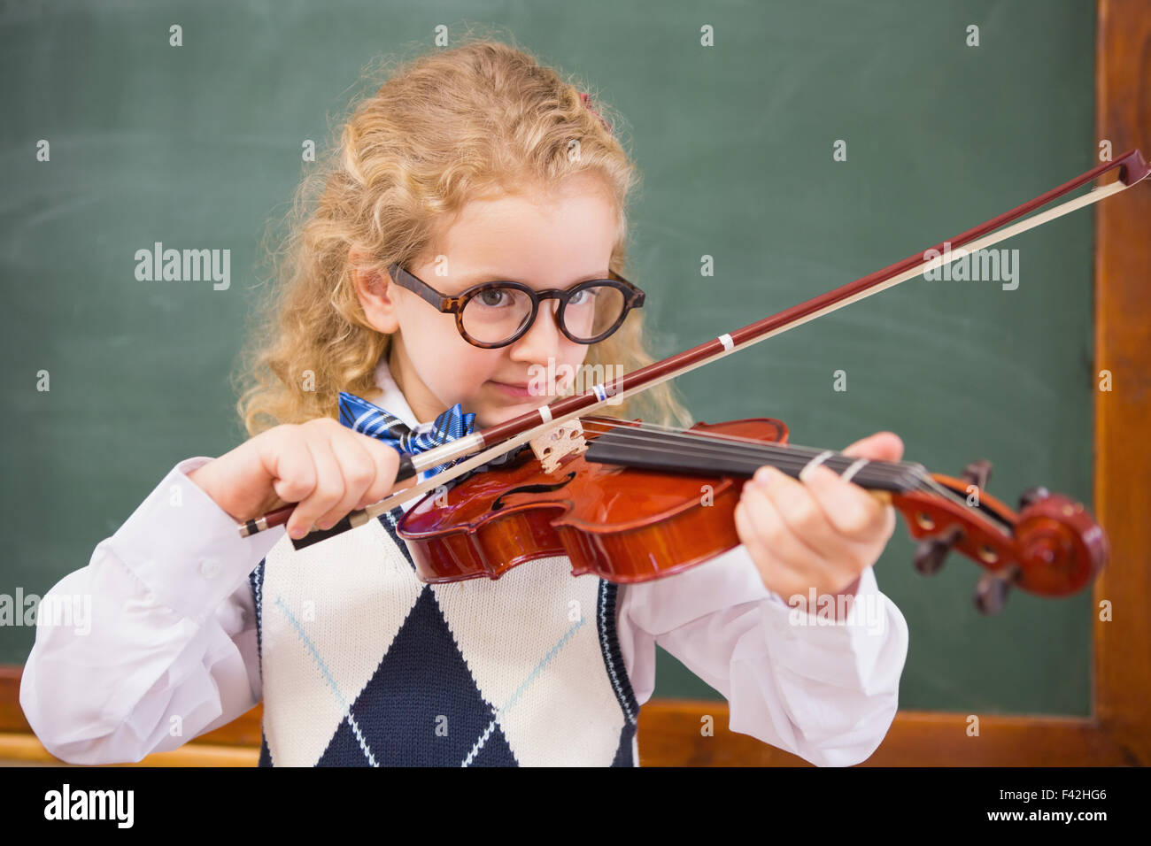 Cute pupil playing the violin Stock Photo - Alamy