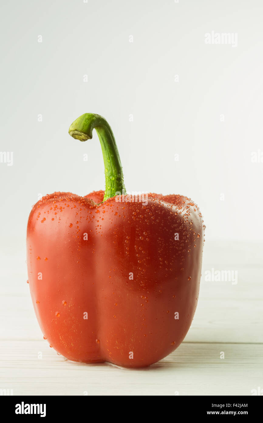 Red pepper on chopping board Stock Photo - Alamy