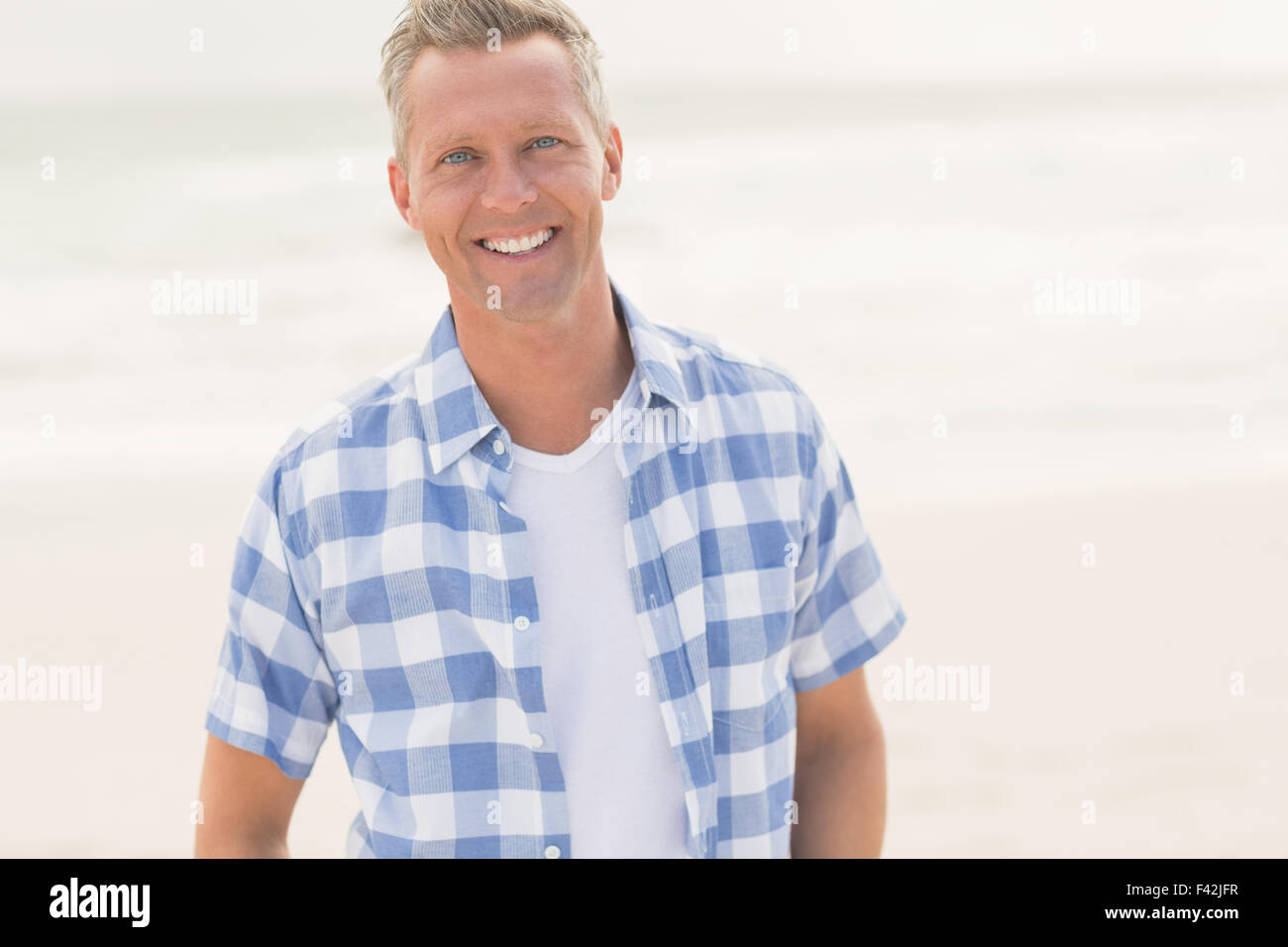 Casual man smiling at camera Stock Photo - Alamy