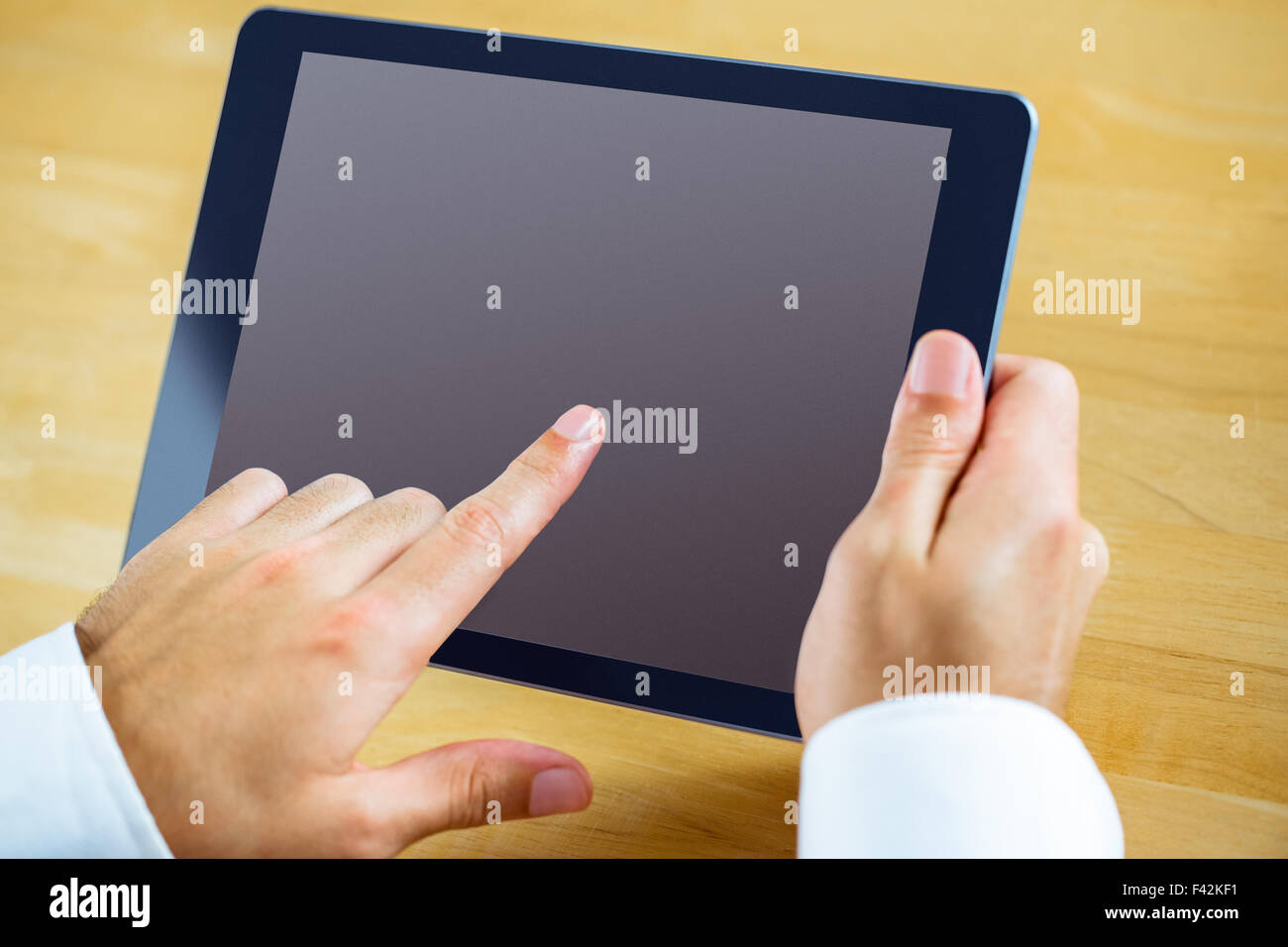 Man using a tablet pc Stock Photo - Alamy