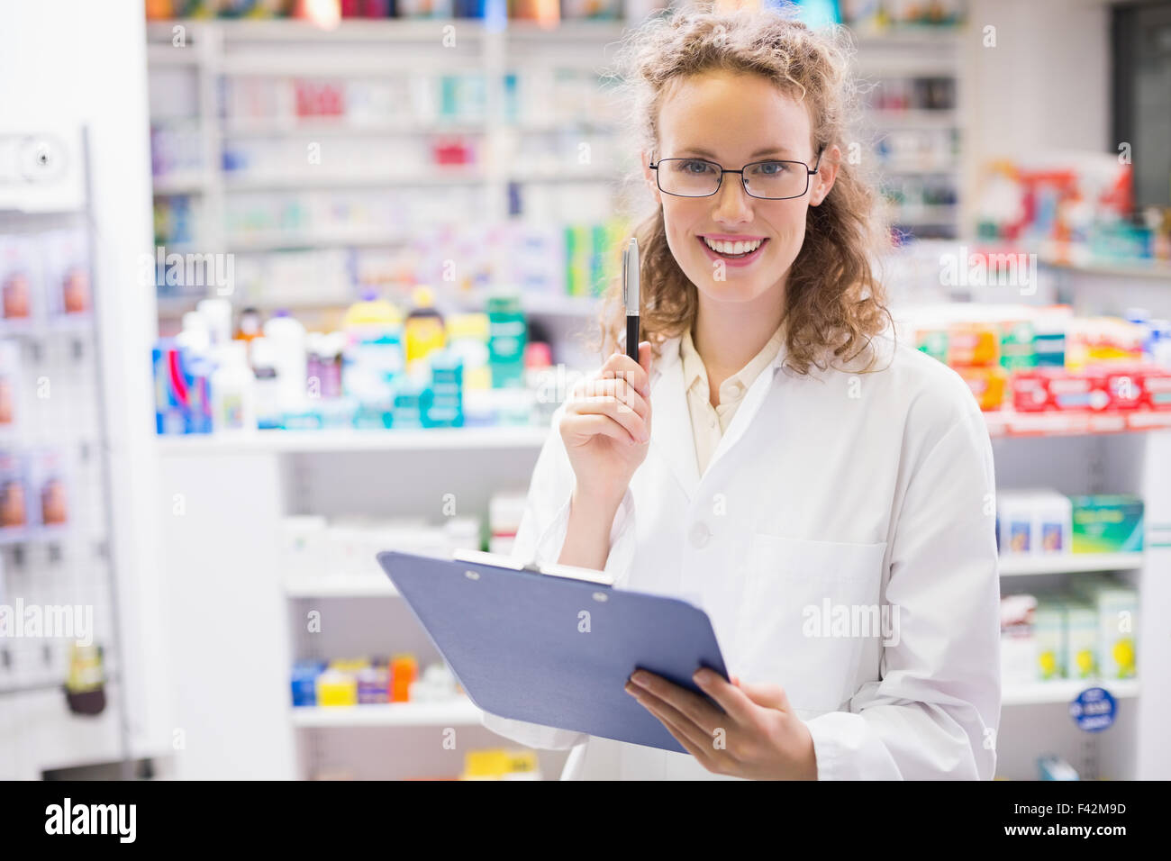 Pharmacist Using A Computer Pharmacist holding computer tablet using hi-res stock photography and ...