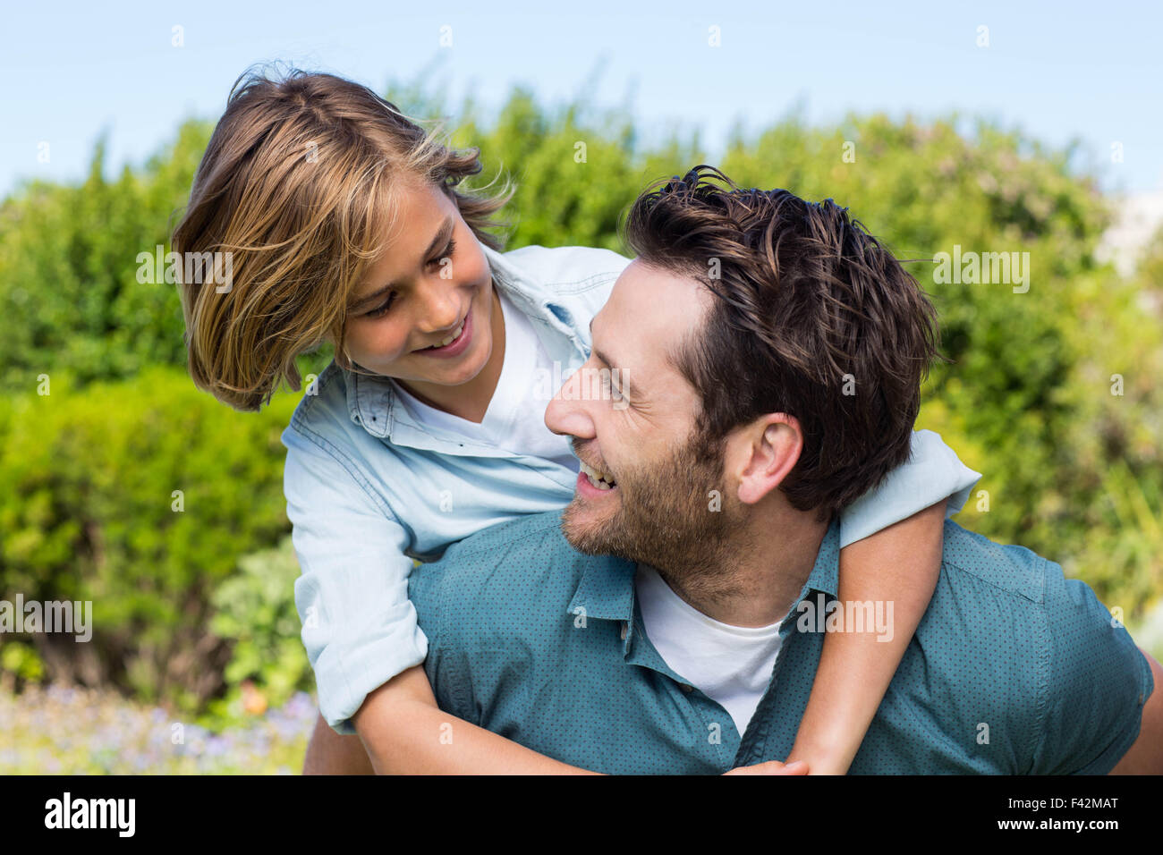True Father Smiling Father and son smiling at each other Stock Photo - Alamy