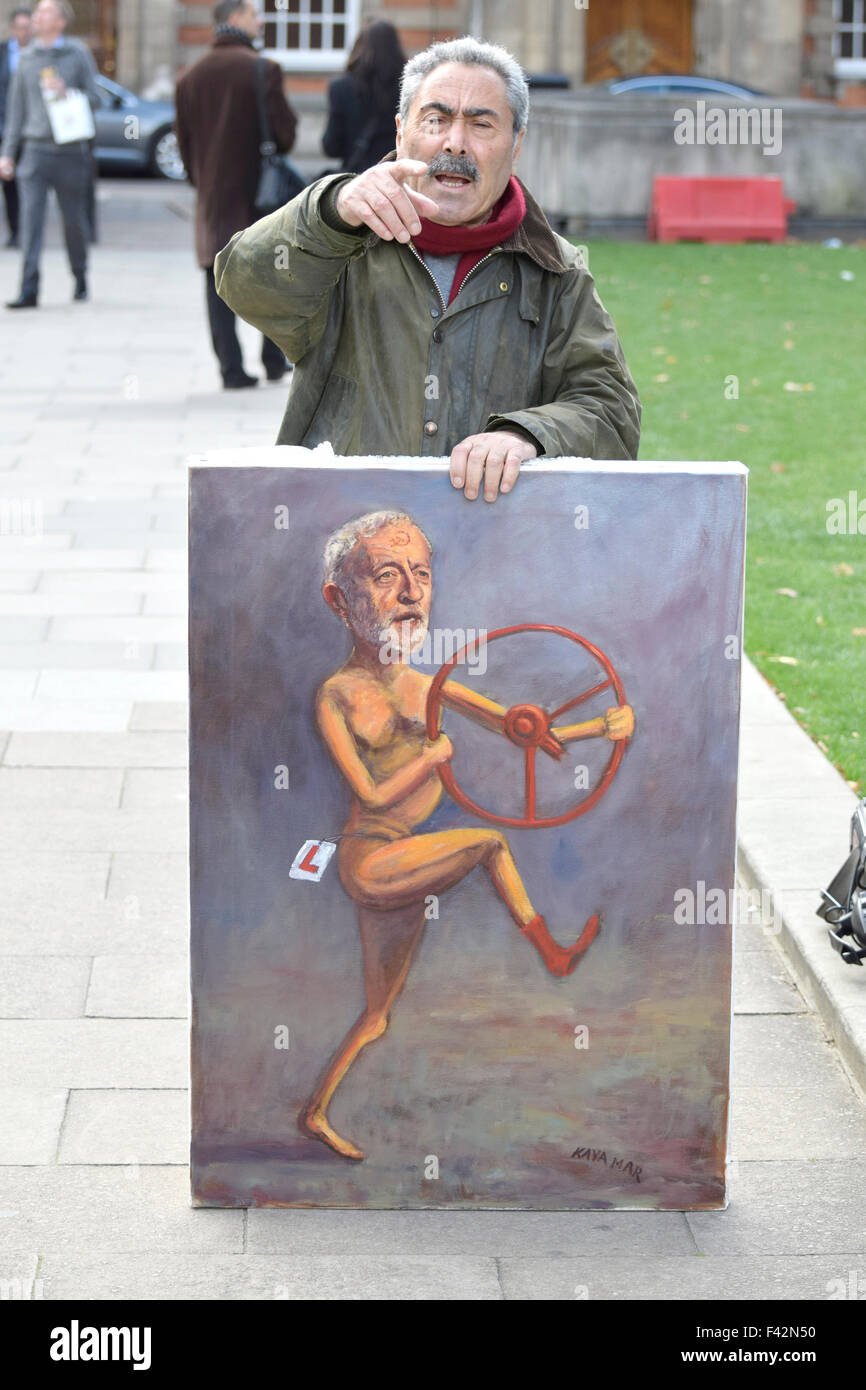 London, UK. 14th October, 2015. Satirical artist Kaya Mar outside the Houses of Parliament as the new Labour leader Jeremy Corbyn takes part in his second Prime Minister's Questions inside Credit:  PjrNews/Alamy Live News Stock Photo