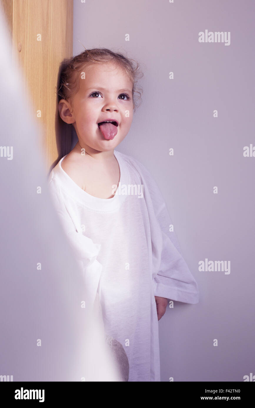 Little girl sticking out her tongue, portrait Stock Photo