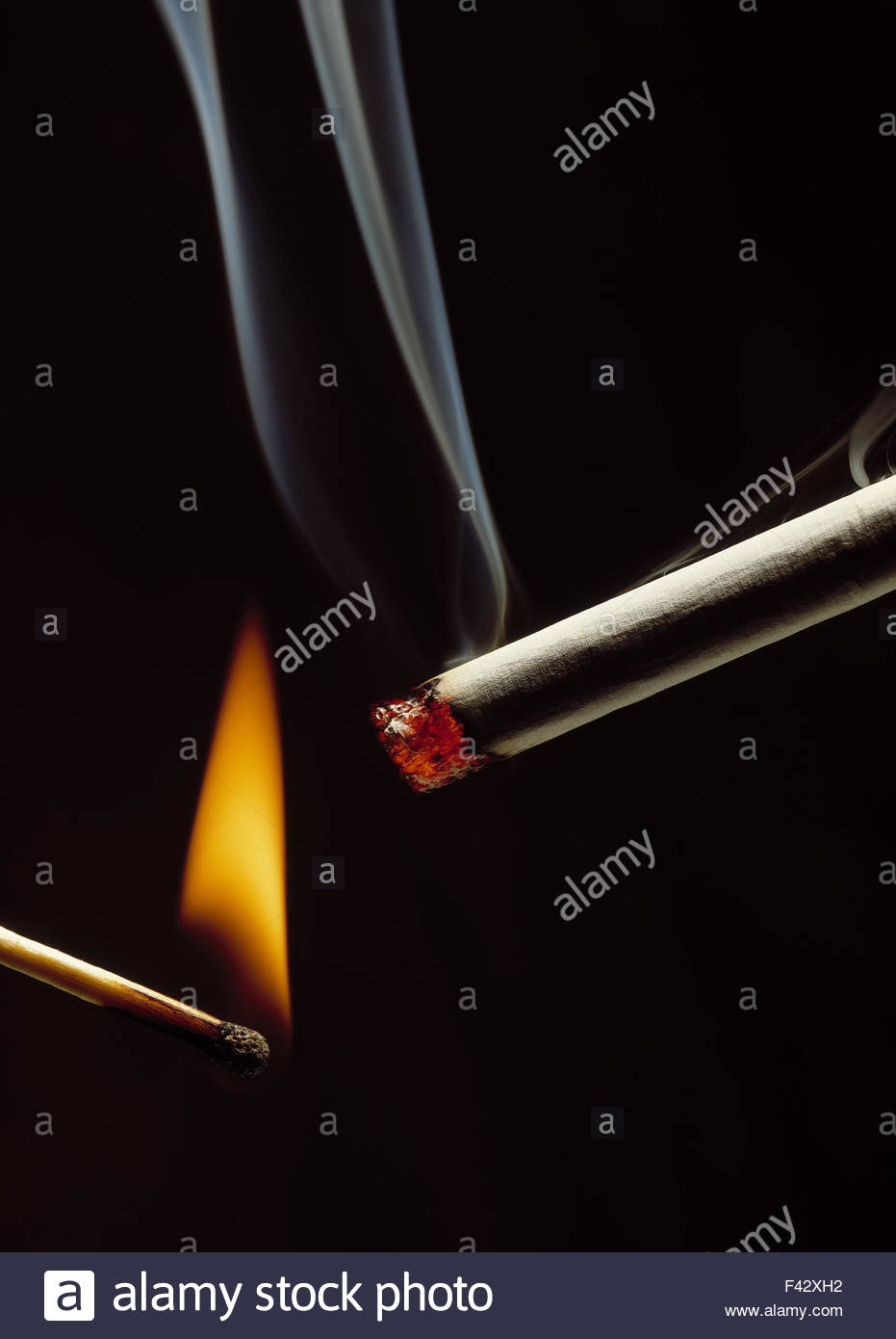 Lighting Cigarette Match Stock Photos & Lighting Cigarette Match Stock
