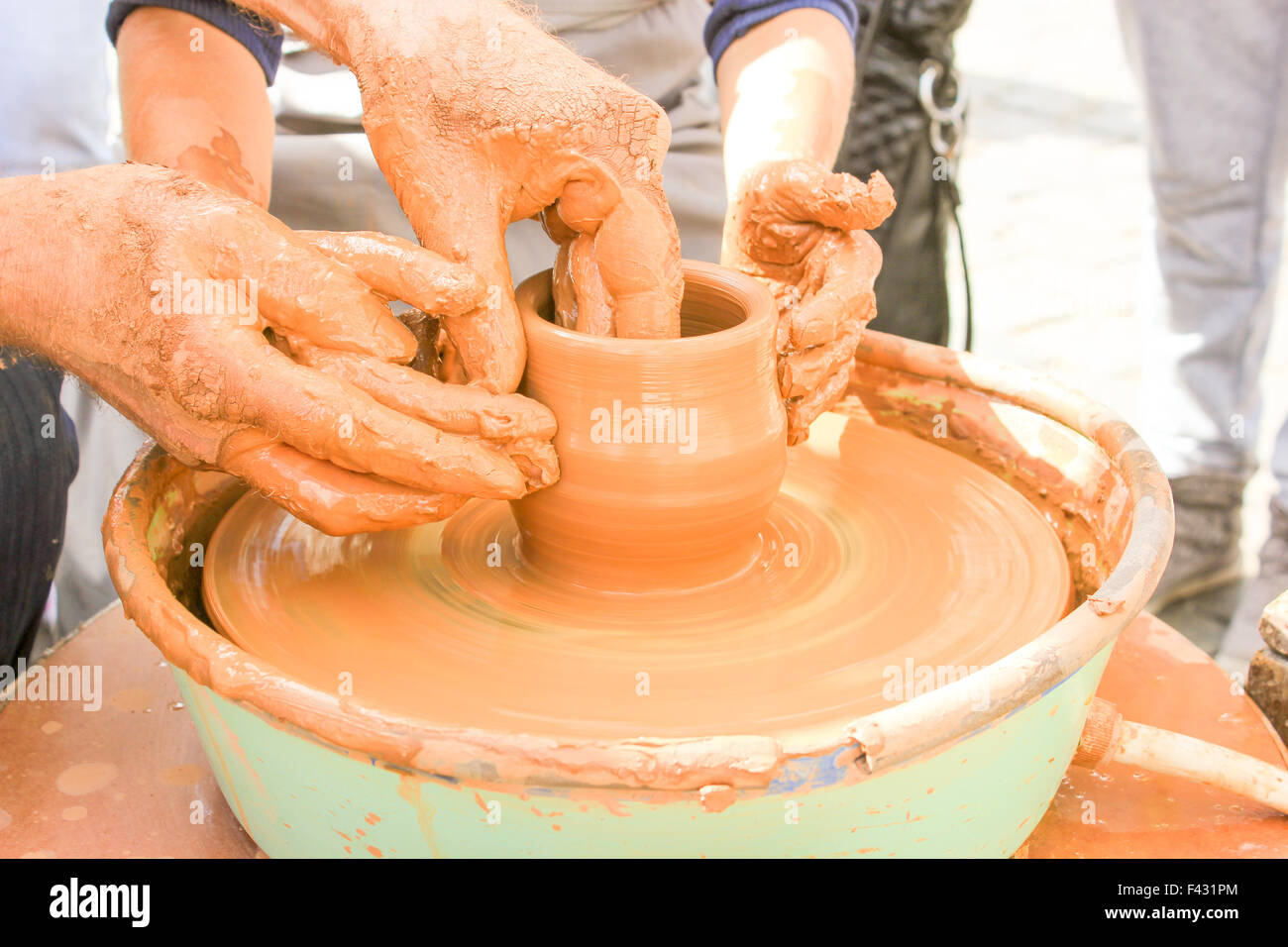 I dont mind getting my hands dirty. an unrecognizable woman molding clay on  a pottery wheel Stock Photo - Alamy